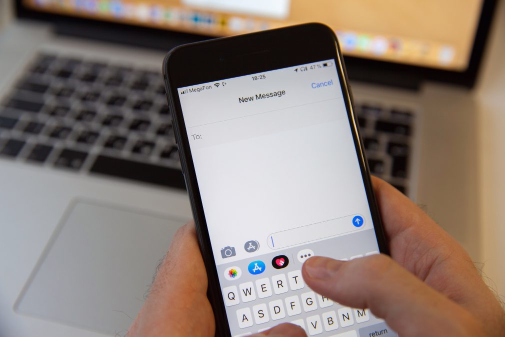 Pesron Sending Text Message Or iMessage On iPhone