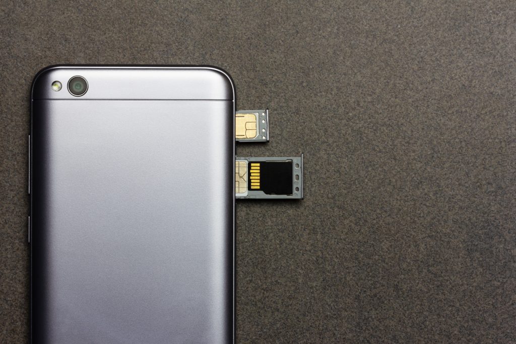 SIM And SD Card Near Smartphone